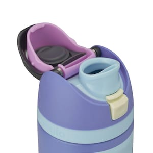 May include: A close-up of a purple and light blue water bottle with a flip-top lid. The lid is open, revealing the drinking spout and a dark gray seal. The bottle has a light blue band around the middle and a cream-colored button.