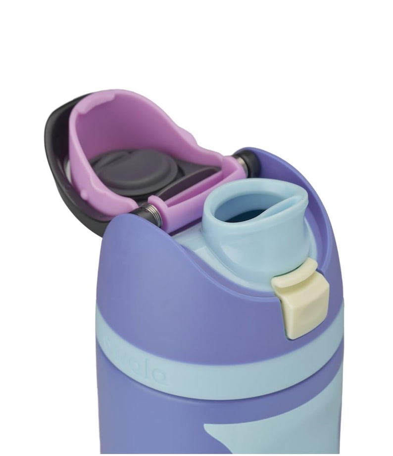 May include: A close-up of a purple and light blue water bottle with a flip-top lid. The lid is open, revealing the drinking spout and a dark gray seal. The bottle has a light blue band around the middle and a cream-colored button.