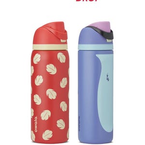 May include: Two insulated water bottles. One is red with white leaf patterns, the other is purple with a light blue curved design. Both have flip-top lids and the brand name "owala" is printed on the bottles. The text "COLOR DROP" is at the top.