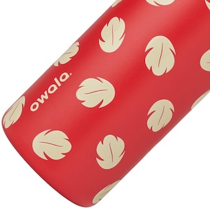 May include: Red water bottle with a pattern of cream-colored leaf shapes. The word "owala" is printed in white on the side of the bottle. The bottle is cylindrical and appears to be made of metal.