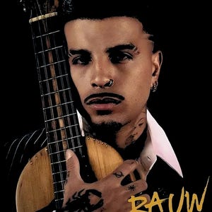 May include: A graphic print featuring a person with a nose ring and tattoos holding a wooden stringed instrument. The person wears a white collared shirt under a dark jacket. The text RAUW ALEJANDRO appears in a stylized gold font on a black background.