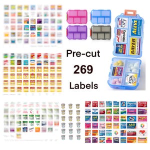 May include: A set of 269 pre-cut labels for medication organizers, featuring various brand names and supplement types. The image includes a blue plastic pill case with multiple compartments, four small rectangular pill boxes, and sheets of labels.
