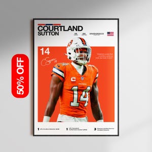 May include: A framed poster featuring Courtland Sutton in an orange Denver Broncos uniform. The poster includes the player's name, position, and team details. The number 14 is prominently displayed on the jersey. A 50% off sticker is on the left.