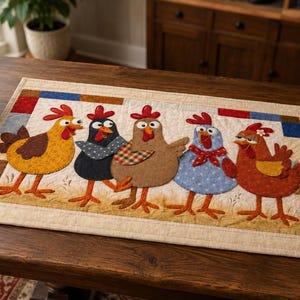 May include: A rectangular fabric table runner featuring a quilted design with five colourful appliqued chickens in yellow, black, brown, light blue, and rust orange. The border consists of small squares in red, blue, and brown on a beige background.