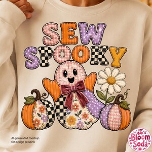 May include: A beige sweatshirt featuring a graphic with the text SEW SPOOKY in colorful patterned letters. The design includes a central ghost wearing a velvet bow, flanked by two pumpkins and a white daisy, all decorated with various plaid, floral, and checkered patterns.