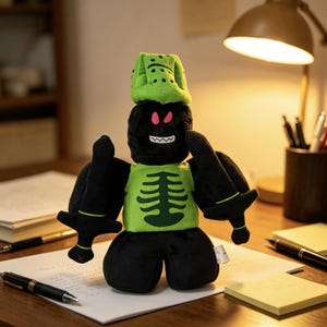 May include: A plush toy featuring a black block-shaped head with red eyes and a white jagged mouth, wearing a lime green helmet and a matching lime green chest piece with a black skeleton rib cage design, holding two black swords in its hands.