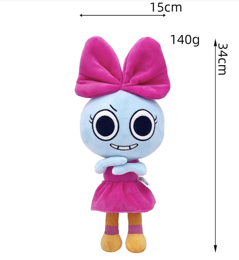 May include: A plush doll with a light blue head, large black eyes, and a wide grin. It wears a large pink bow on its head and a matching pink dress. The doll has orange feet and measures 15 cm in width, 34 cm in height, and weighs 140 grams.