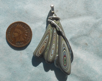 Fordite Carved Silver Wrapped Pendant