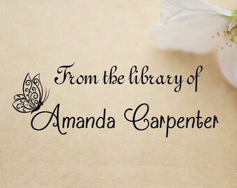 May include: A black and white butterfly illustration with a decorative design. The text "From the library of Amanda Carpenter" is below the butterfly.