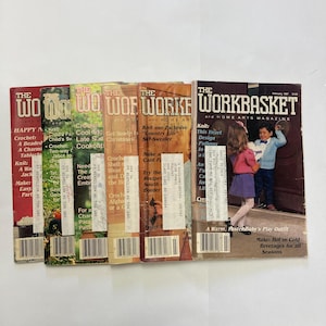 May include: A collection of six vintage The Workbasket and Home Arts magazines from the 1980s. Each issue features a colourful cover with various craft project titles, including knitting, crochet, and sewing patterns, along with a barcode and address label.