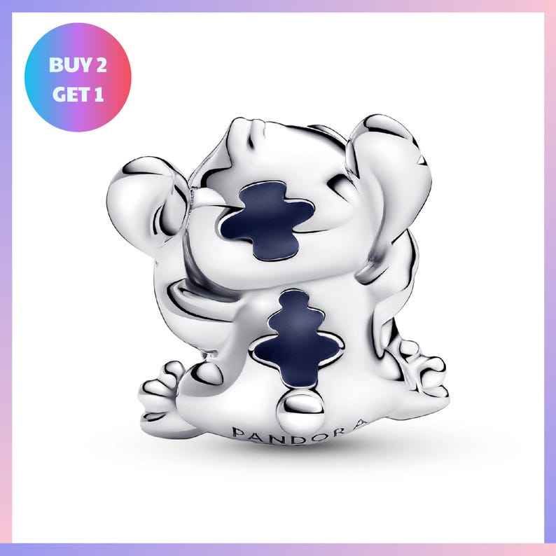 A silver-colored pendant in the shape of a cartoon character, with a blue background and the word "PANDORA" written on it.