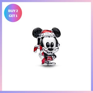 A silver charm in the shape of a cartoon character, resembling Mickey Mouse, is displayed against a white background.