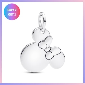 A silver charm in the shape of a Mickey Mouse with two bows.