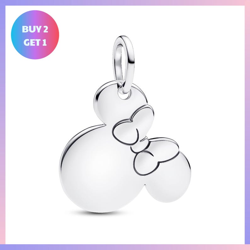 A silver charm in the shape of a Mickey Mouse with two bows.