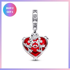 A heart-shaped charm with a red background and a silver frame, featuring a Disney character design.
