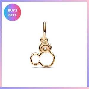 A gold-colored charm in the shape of a cloud with a small gemstone in the center.