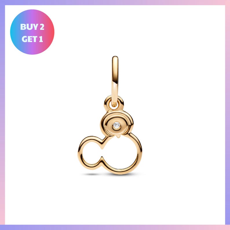 A gold-colored charm in the shape of a cloud with a small gemstone in the center.