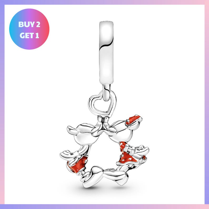 A silver charm bracelet with a heart-shaped clasp and a playful design featuring cartoon-like figures.