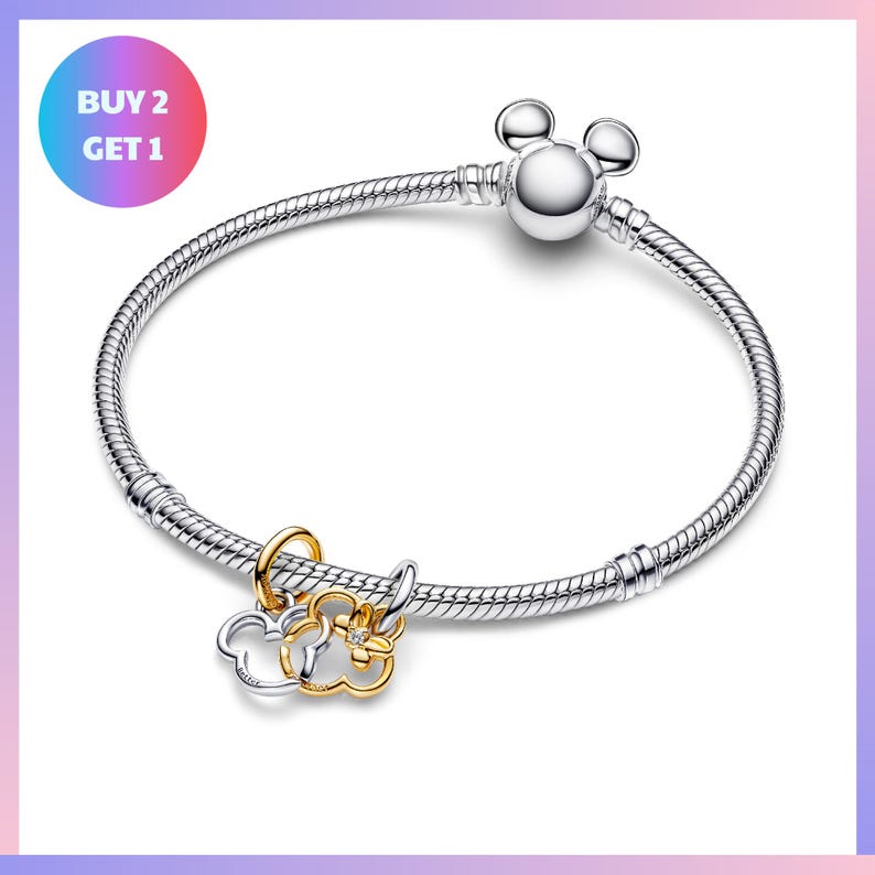 A silver bracelet with a charm and a tag that says "BUY 2 GET 1".