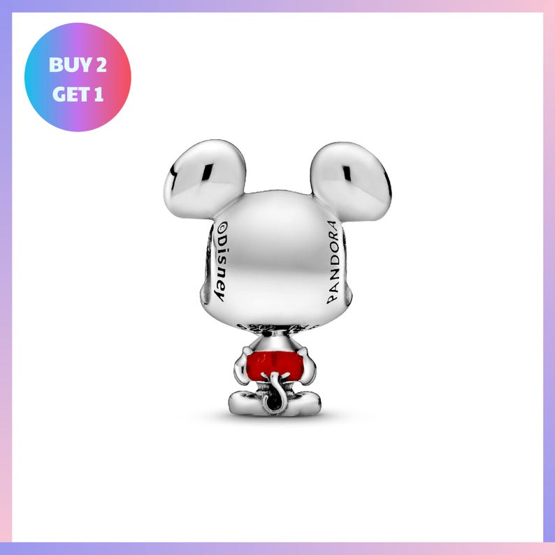 A silver charm in the shape of a cartoon character, with the word "Disney" written on it.