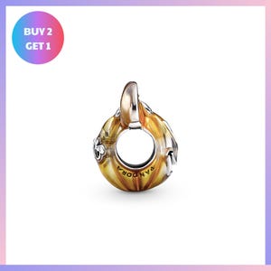 a round pendant with a floral design, and it is presented against a white background.