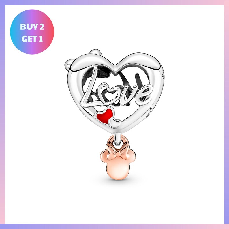 a heart-shaped charm with the word "Love" engraved on it, along with a small pink mouse charm hanging from it.
