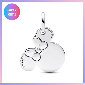 A silver charm in the shape of a Mickey Mouse, with the text "Disney" printed on it.