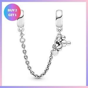 a silver-colored charm bracelet with a chain and a small charm attached to it.