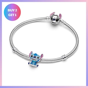 A silver-colored charm bracelet with a blue and purple Stitch character charm on it.