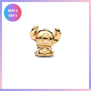a shiny gold-colored charm in the shape of a cartoon character, possibly a character from a popular animated series.