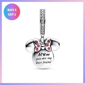 A silver charm bracelet with a charm in the shape of Minnie Mouse and the text "Mom you are my best friend" engraved on it.