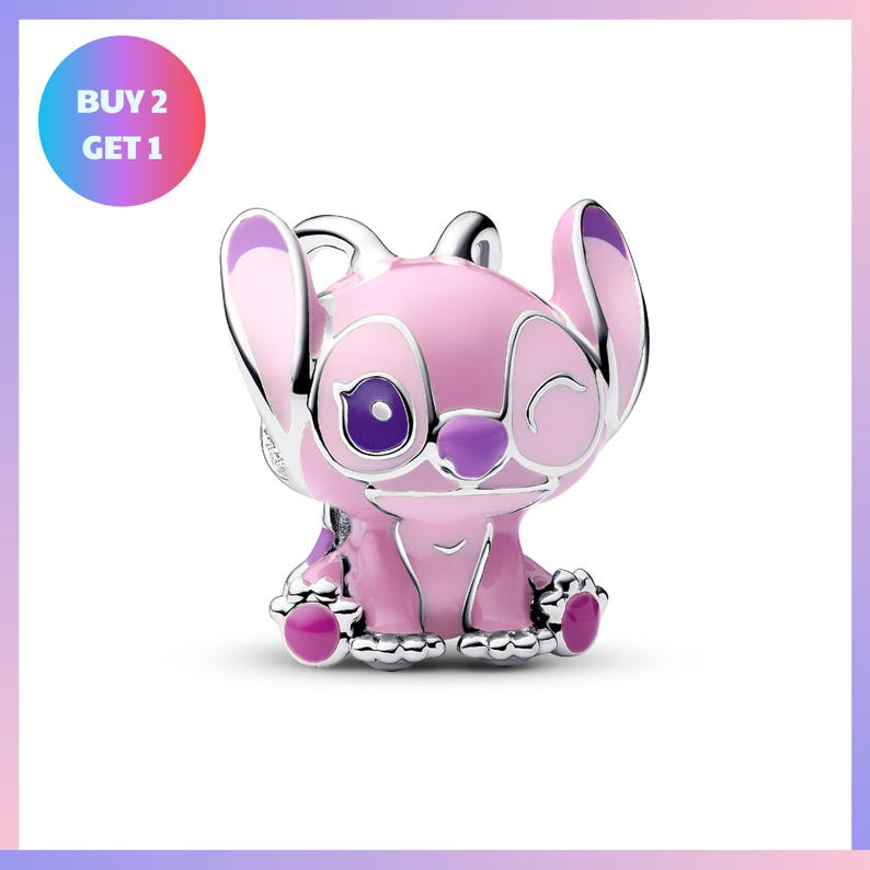 A pink and purple Stitch charm with a smiling expression, sitting on a white background.