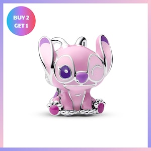 A pink and purple Stitch charm with a smiling expression, sitting on a white background.