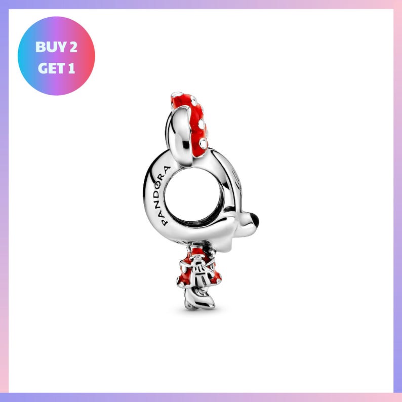 A silver pendant in the shape of a cat with a red bow on its head, and the word "VANDORA" engraved on it.