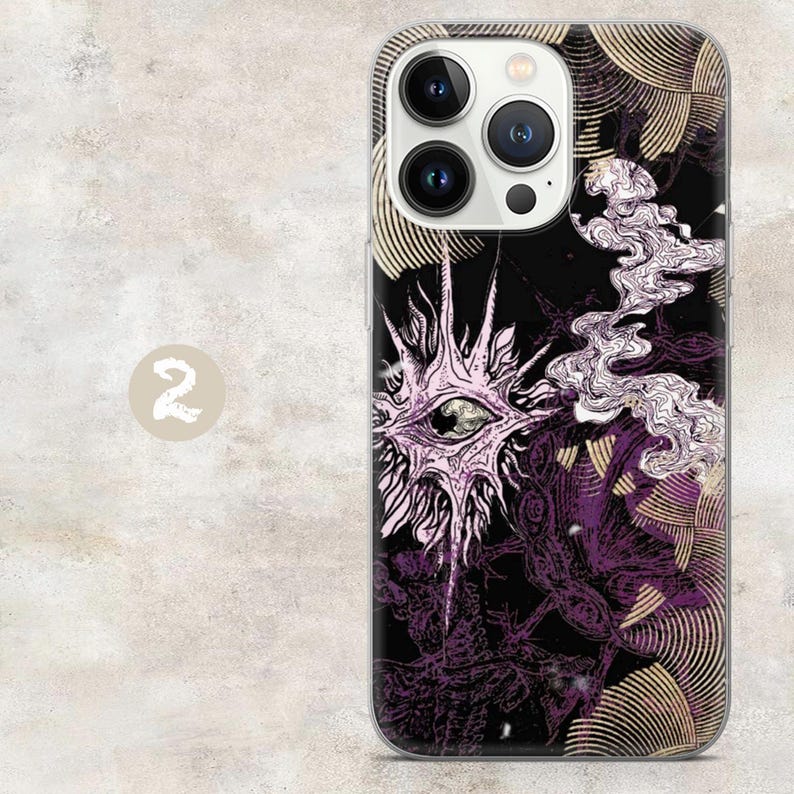 May include: A smartphone case featuring a black background with a central light purple eye graphic surrounded by radiating spikes. The design includes swirling white smoke-like patterns and gold-toned circular line motifs throughout the surface.