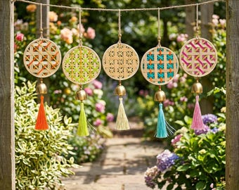 May include: Five circular woven bamboo wall hangings suspended on a string. Each hoop features a unique lattice pattern with coloured thread accents in orange, lime green, teal, and pink, finished with a gold-toned metal bell and a matching tassel.