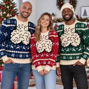 May include: Three long-sleeve knit jumpers in navy blue, red, and dark green. Each jumper features a cream-coloured chest panel with a large, textured, beige graphic design, accented by white snowflake and reindeer patterns along the sleeves and hem.