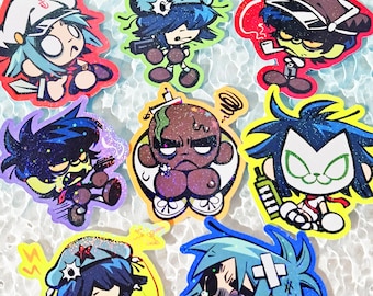 Puede incluir: Un conjunto de ocho pegatinas de vinilo con purpurina que muestran personajes de dibujos animados estilizados con colores de pelo vibrantes, incluyendo azul, verde y negro, con varios sombreros y accesorios, con el texto 8 pcs!! en la esquina inferior derecha.