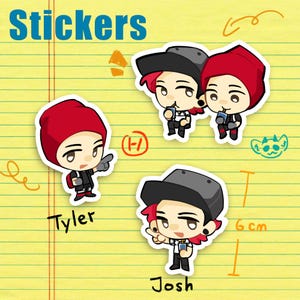 Puede incluir: Un conjunto de pegatinas con ilustraciones de dibujos animados de dos personajes. Uno lleva un gorro rojo, el otro una gorra gris. Las pegatinas están sobre un fondo amarillo rayado con la palabra "Stickers" en azul.