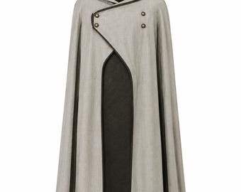 May include: A floor-length hooded cloak featuring a light gray outer layer and a dark charcoal inner lining. The garment has a structured hood, a high collar, and an asymmetrical front closure secured with four metallic buttons along the edge.