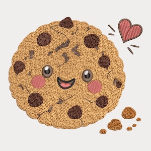 May include: An embroidered design of a round, tan chocolate chip cookie with a smiling face, pink cheeks, and large dark eyes. A small pink heart is positioned to the upper right, and several small cookie crumbs are scattered below the main cookie.