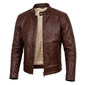 May include: A dark brown jacket featuring a textured snakeskin pattern throughout the exterior. The jacket includes a stand-up collar with a single snap button closure, a central metal zip, and two side pockets with zip closures. The interior is lined.