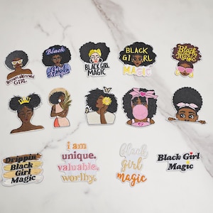 May include: A collection of fourteen embroidered patches featuring diverse illustrations of Black women, girls, and inspirational text including Black Girl Magic, I am unique, valuable, worthy, and Drippin Black Girl Magic in various colors and fonts.