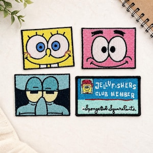 May include: Four rectangular embroidered patches featuring characters and text from SpongeBob SquarePants. One patch shows a yellow face with large blue eyes, one a pink face, one a blue character with a large nose, and one a Jellyfishers Club Member card.
