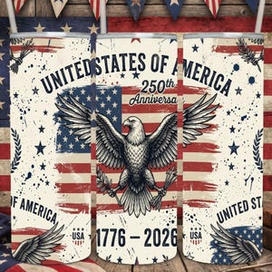 May include: A cylindrical tumbler featuring a distressed American flag background with a central bald eagle graphic. Text reads UNITED STATES OF AMERICA 250th Anniversary 1776-2026. The design includes blue stars, red stripes, and olive branches.