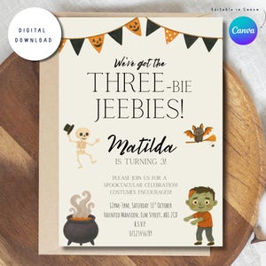 May include: A cream-colored birthday invitation card featuring black and orange bunting, a skeleton in a top hat, a bat on a broomstick, a steaming cauldron, and a zombie. The text reads: We've got the THREE-BIE JEEBIES! Matilda IS TURNING 3!