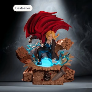 May include: A detailed figurine of an anime character with blonde hair and a red cape. The figure is posed dynamically, surrounded by blue energy effects and a textured base. The word "Bestseller" is in a white box.
