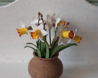 Pentecost lilies and willow branches in a jar