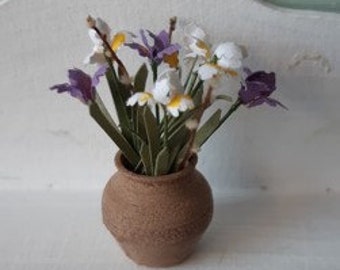 White and purple iris in a jar