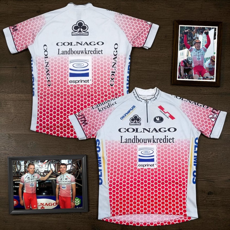 May include: Two white and red cycling jerseys featuring a honeycomb pattern, short sleeves, and a half-zip front. The jerseys display the Colnago, Landbouwkrediet, and Esprinet logos. Two framed photographs show cyclists wearing the same jersey design.